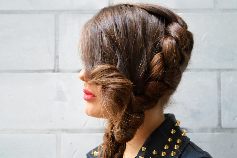 Side French braid styled on woman with brown hair