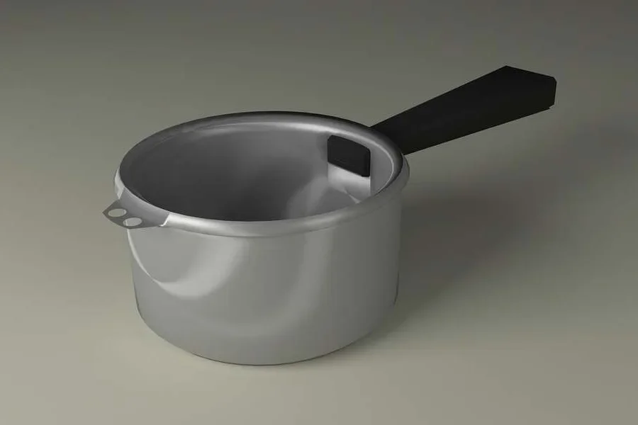 灰色の表面に置かれた銀色の鍋