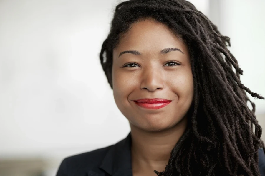 Smiling woman with long sisterlocks