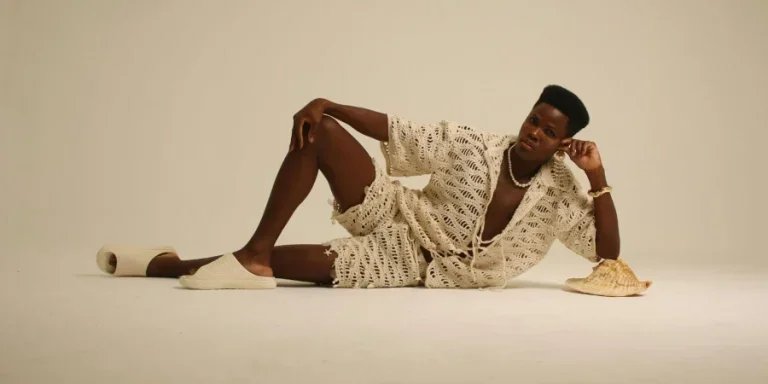 Stylish Male Model in Crochet Outfit Posing Indoors