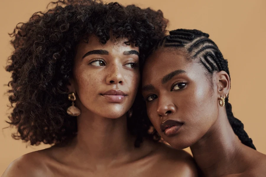 Two Black women, one with Fulani braids