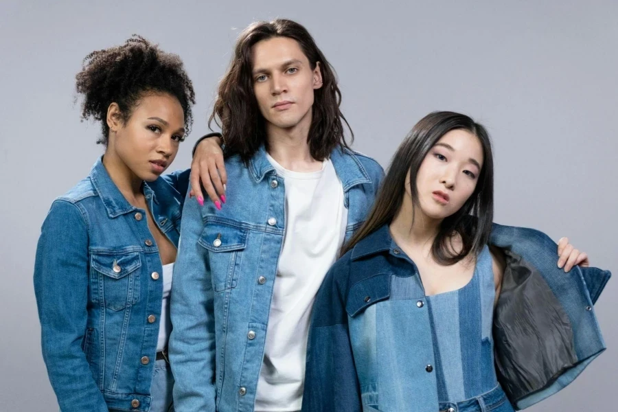 Two Women and Man In Blue Denim Outfits