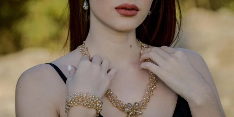 Woman Wearing Gold Necklace