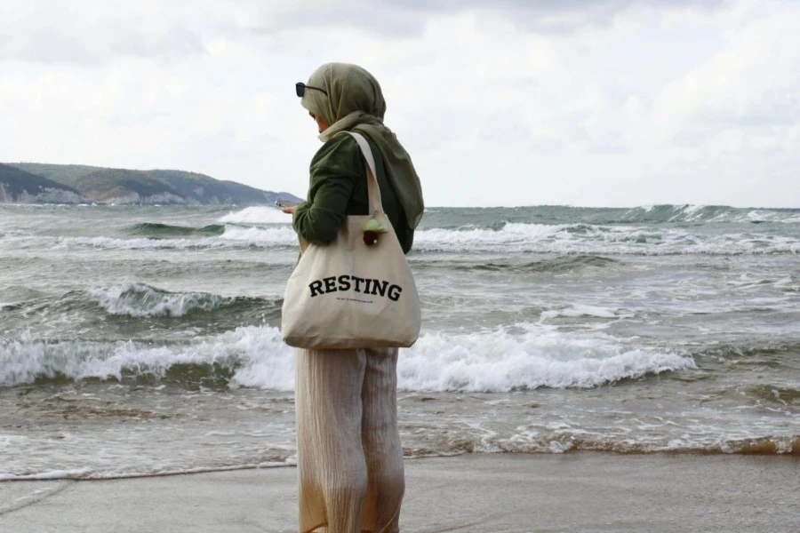 Woman in Hijab on Sea Shore