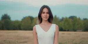 Woman rocking a white V-neck dress