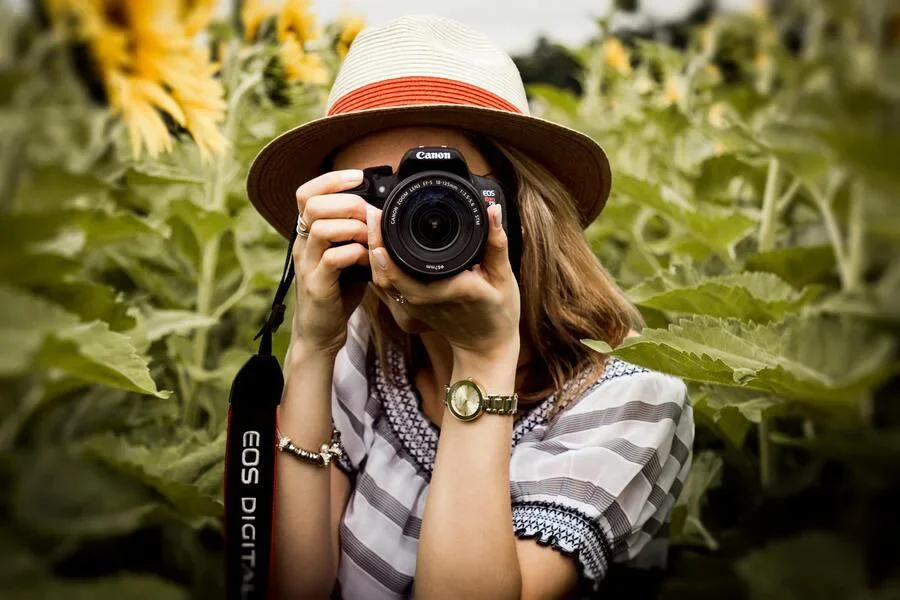Woman taking picture with a DSLR camera