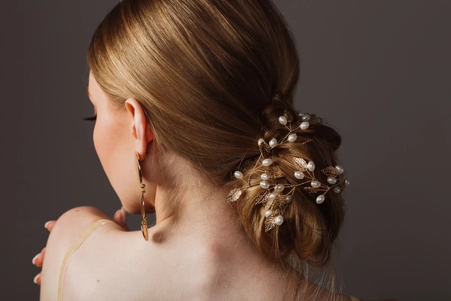 Woman with a low bun and accessories