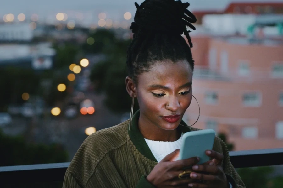 Woman with invisible locs on a terrace