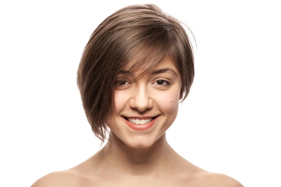 Woman with short hair and side-swept fringe on the right