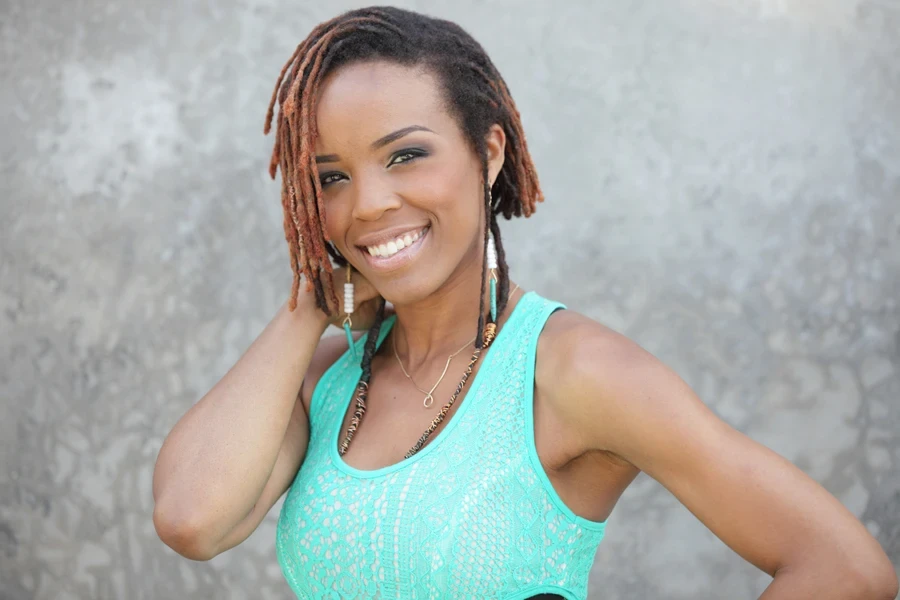 Woman with short, tinted sisterlocks