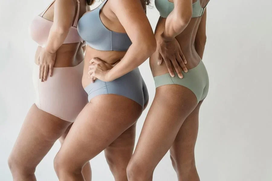 Women posing for a photo in underwear
