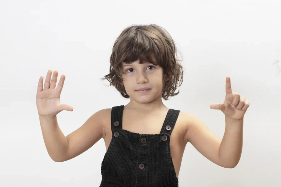 Young boy with wavy bob short hair and fresh bangs