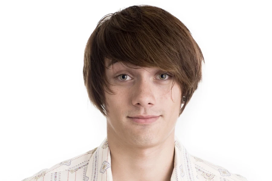 Young man with mod cut and side-swept fringe