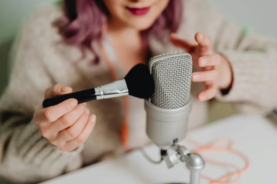 A Woman Brushing a Microphone
