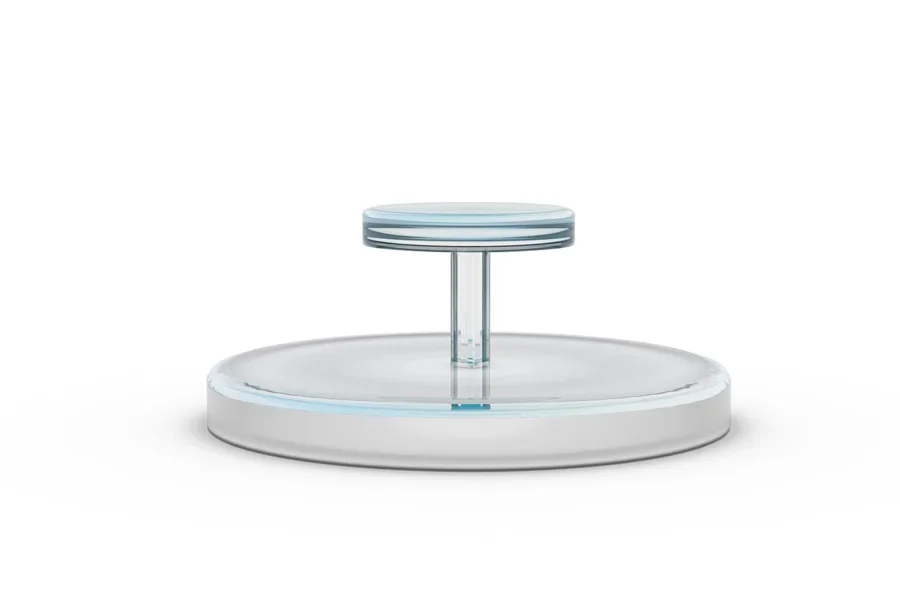 A glass two-tier rotating stand on a white background
