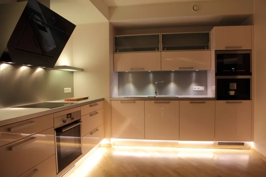 A kitchen with puck under cabinet lighting