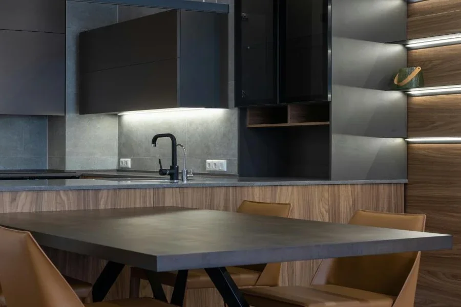 A kitchen with under cabinet lighting