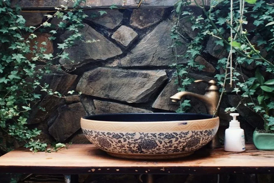 A natural washbasin in a bathroom with greenery
