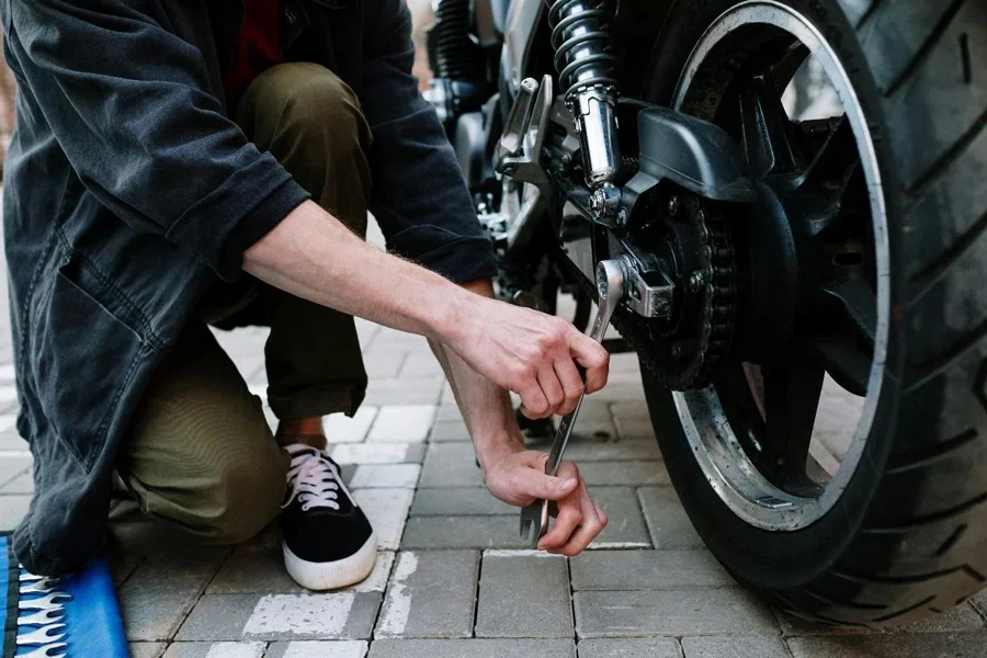 A person fixing a motorcycle
