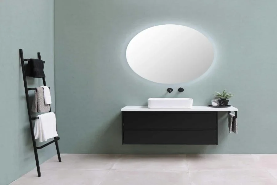 A rectangular washbasin on a black vanity