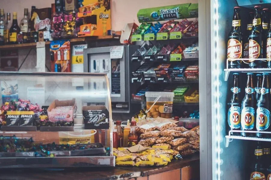 A refrigerator stocked with bottled beers