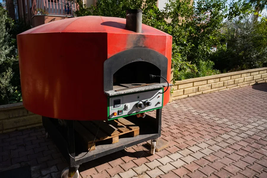 A rolling pizza cart oven