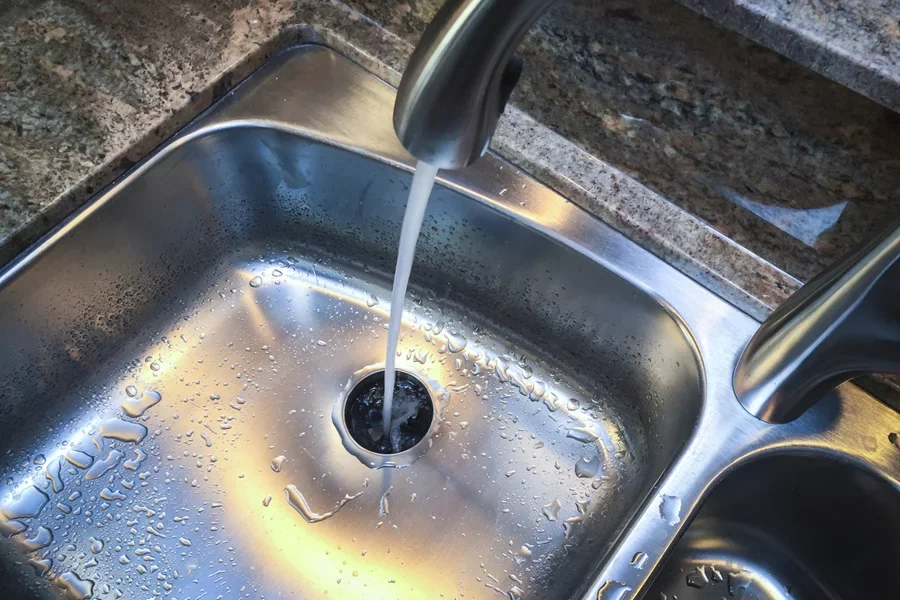 A stainless steel kitchen sink drain