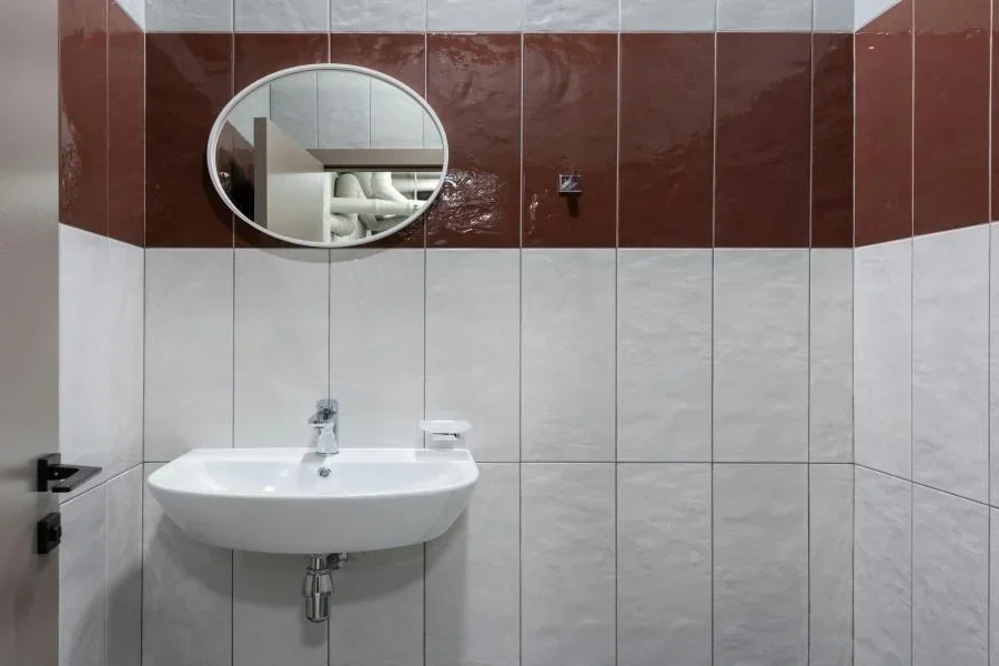 A wall-mounted washbasin in a bathroom