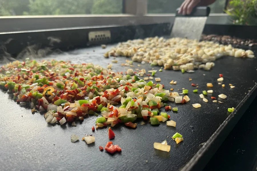 Chopped vegetables and square-diced potatoes at lunch