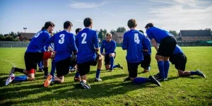 Group of Sports Player Kneeling on Field