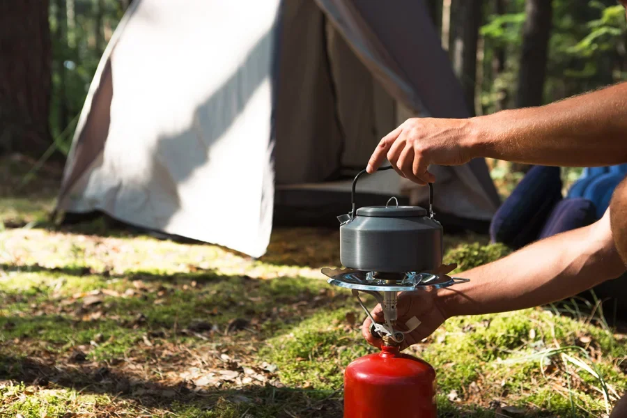 Mini gas cylinder used as a camping stove