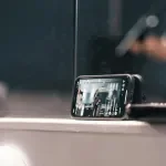 Mobile Phone Leaning on Mirror