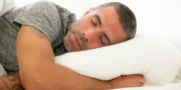 Serene image of a man resting peacefully on a pillow, capturing a moment of calm and relaxation