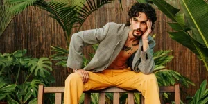 Stylish Model Posing on Wooden Bench in Garden