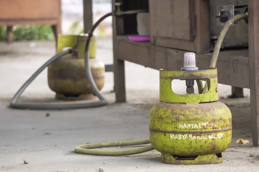 Two green mini gas cylinders