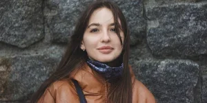A girl model wearing a brown winter jacket