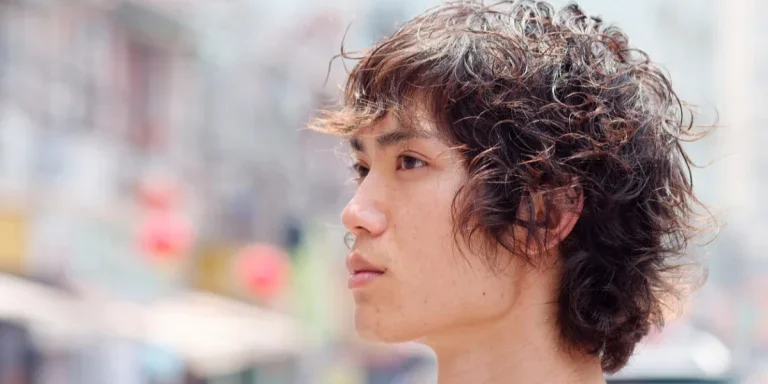 A man with a wolf cut