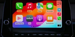 Close-up of a car's modern touchscreen display showcasing various app icons for enhanced in-car connectivity