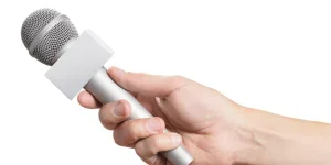 Hand holding a wireless microphone