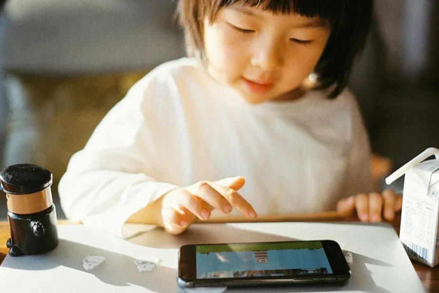 Kid playing on a tablet