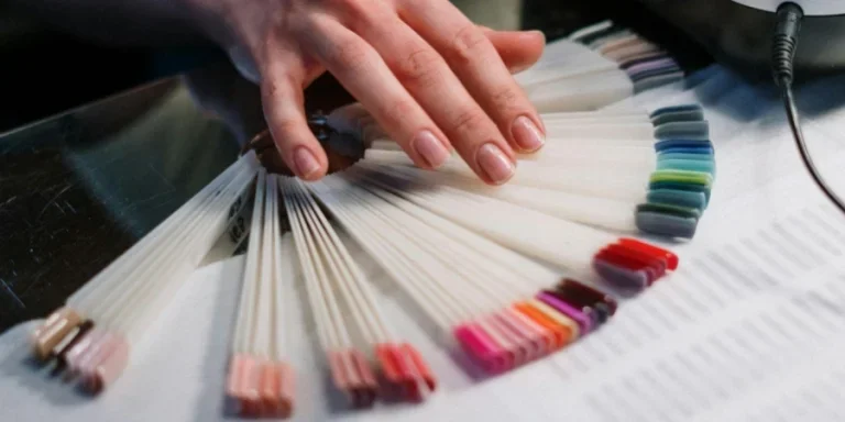 People Choosing from Various Artificial Fingernails