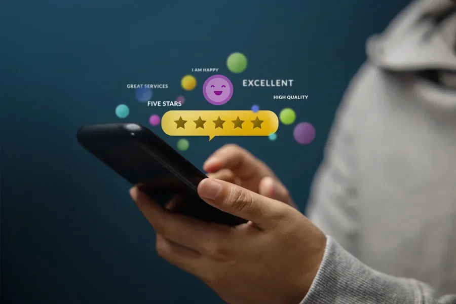 Person holding a smartphone reading reviews
