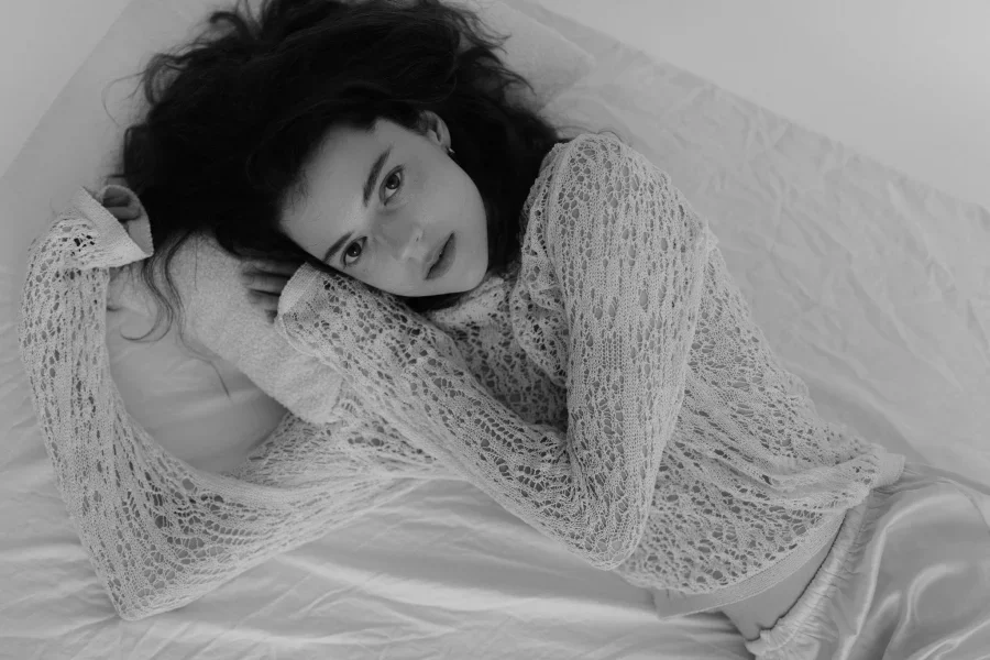 Woman Lying Down in Sequin Blouse