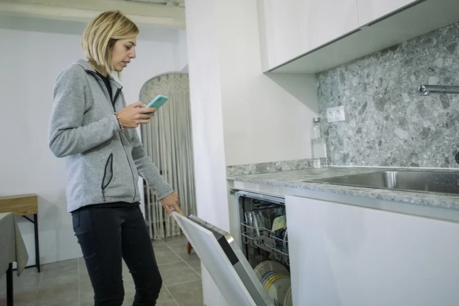 Woman Using the Dishwasher