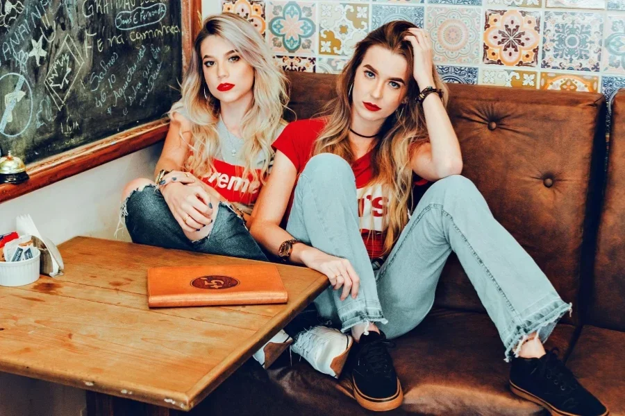 Women Sitting On Sofa