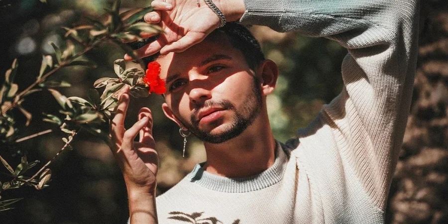 Young Man Posing With Flower
