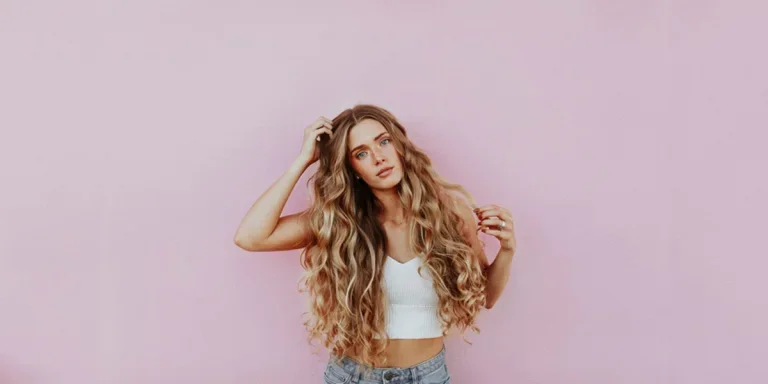 a young woman flaunting her caramel highlights tresses