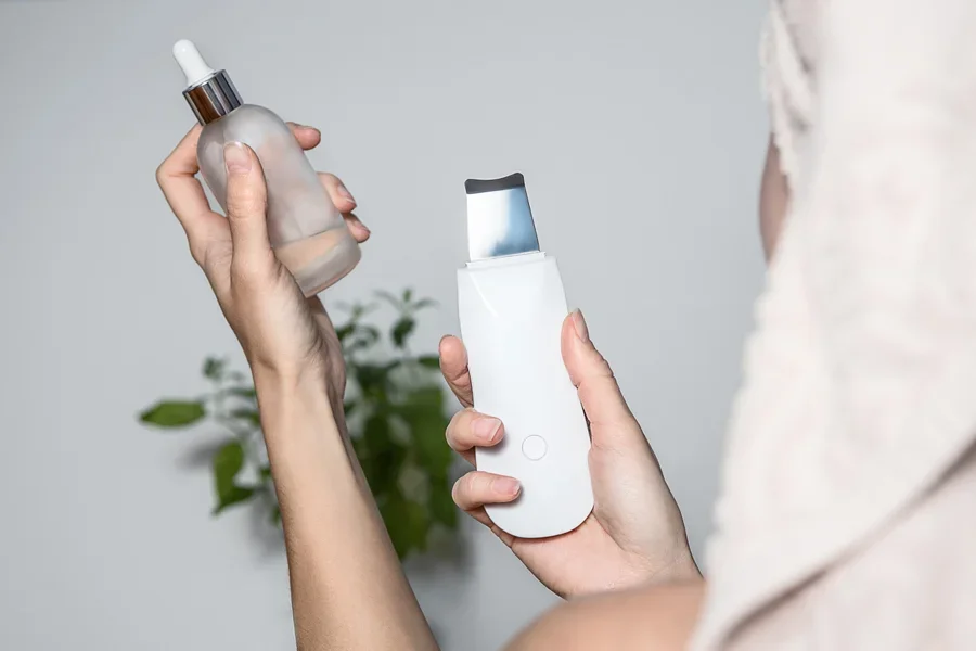 A woman holding skin products