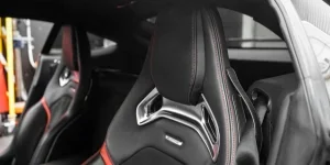 Close-up of a sleek, modern luxury car seat highlighting premium materials and design