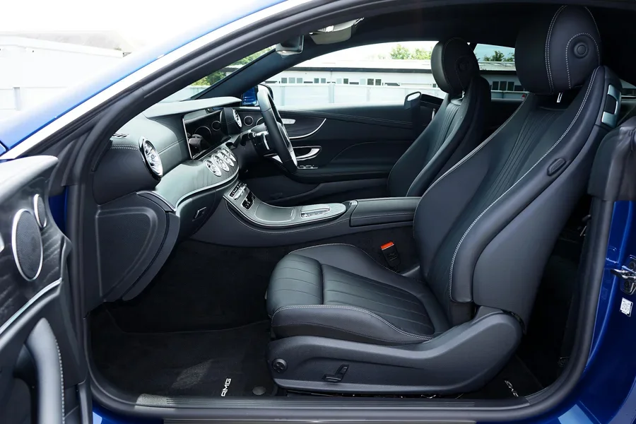 Elegantly designed modern car interior featuring luxurious leather seats and a sleek dashboard